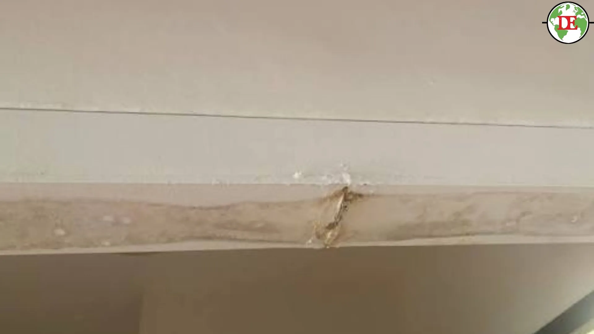 Cracked PVC aircon trunking casing with water stain on wall Singapore