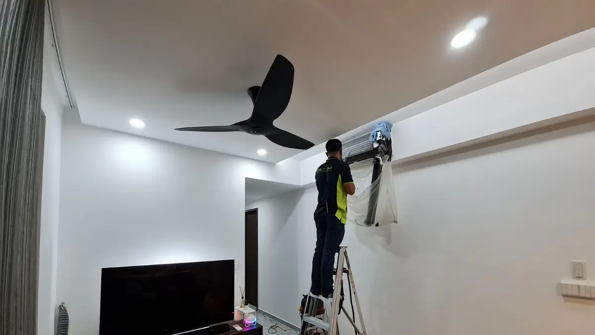 Professional HVAC technician servicing unit